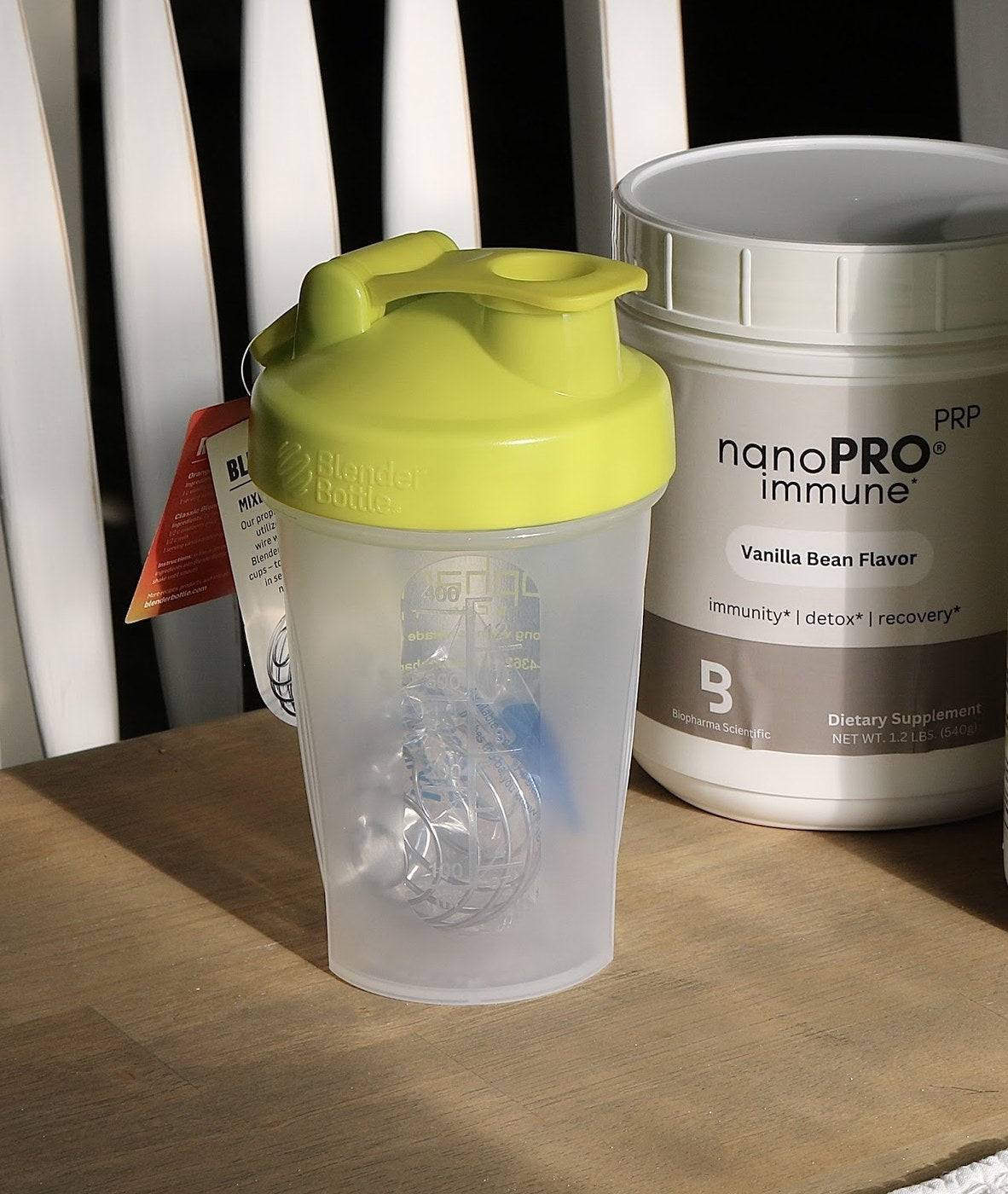 nanoPRO immune vanilla bean tub and a shaker bottle on a table
