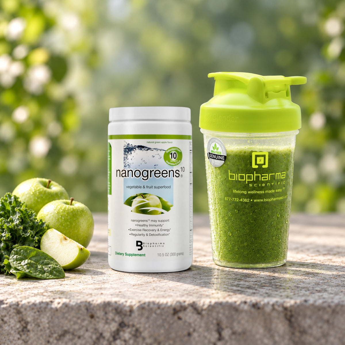 NanoGreens10 Green Apple tub next to a BioPharma Scientific shaker filled with a green drink, with green apples and kale